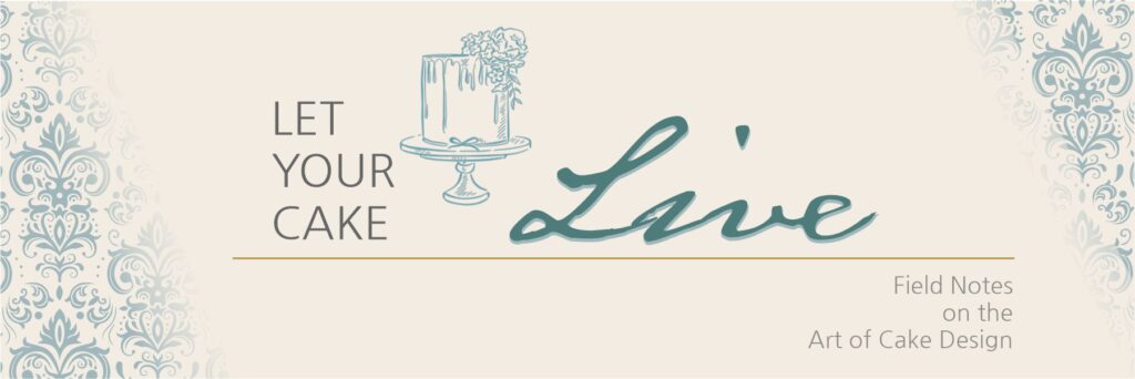 Let Your Cake Live logo with restrained damask framing, open central space, and balanced emphasis on the word “Live.”
